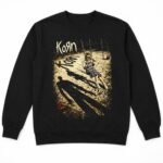 Sudadera negra unisex con el arte del primer álbum de Korn en tonos arena y violeta
