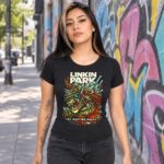 Chica con playera negra de Linkin Park The Hunting Party frente a muro con grafiti