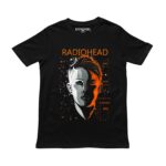 Playera negra con diseño de Radiohead: rostro dividido en blanco y naranja con letras flotantes